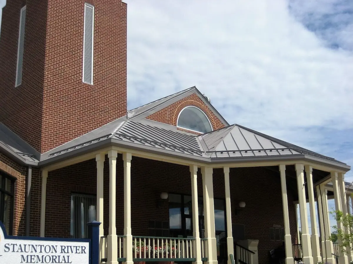 Skilled roofing craftsmen working on a residential roof in Manatawny